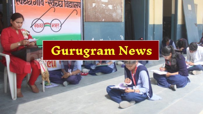 Gurugram Board examinations : Students giving board exam sitting on the ground in Gurugram