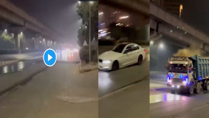 Car jumping in the air, sparks on the road